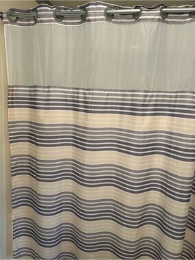 Striped Hookless Shower Curtain in Gray, white and yellow stripes.